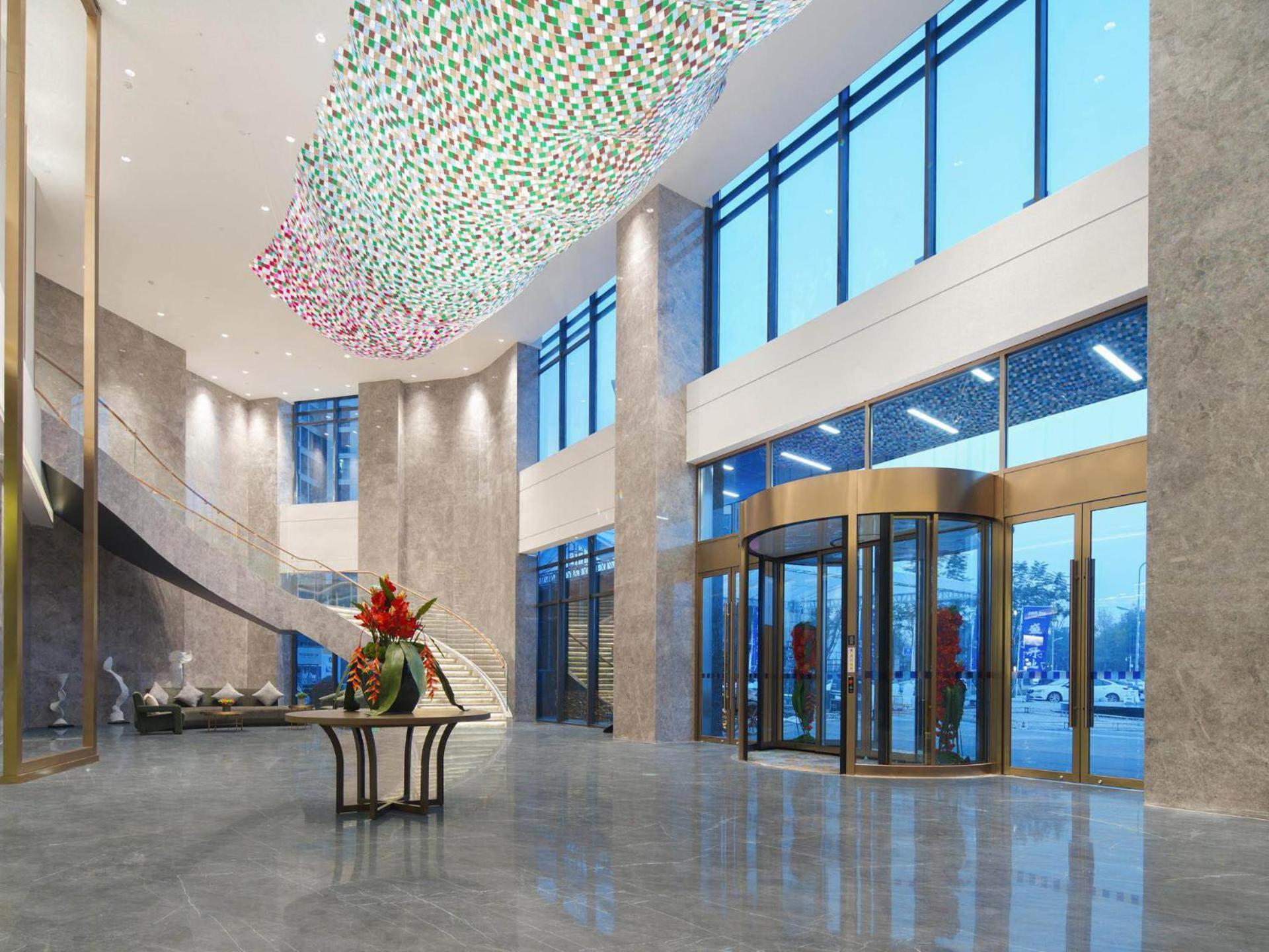 Park Inn By Radisson Nanchong Yilong Star City Plaza Esterno foto