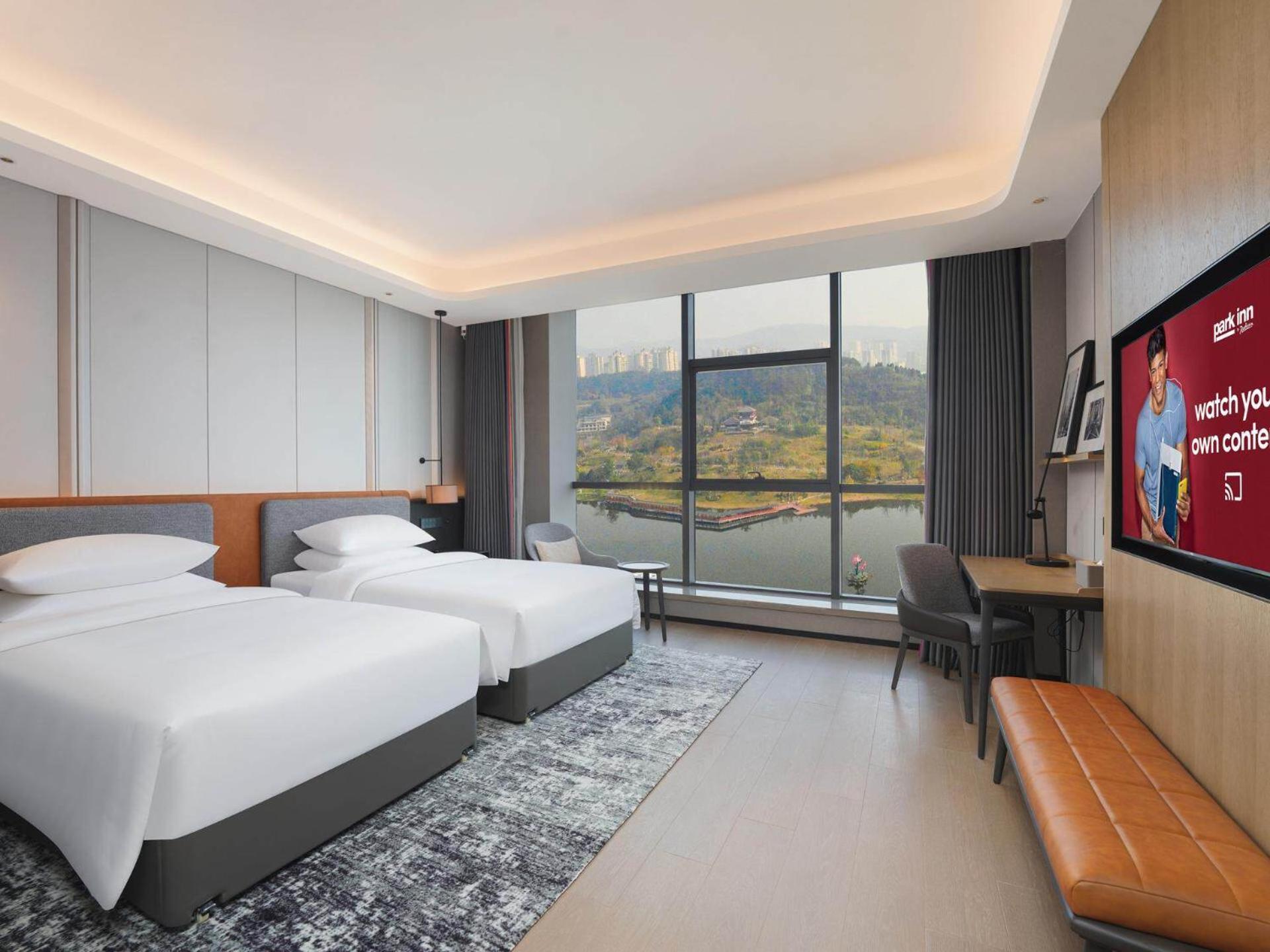 Park Inn By Radisson Nanchong Yilong Star City Plaza Esterno foto