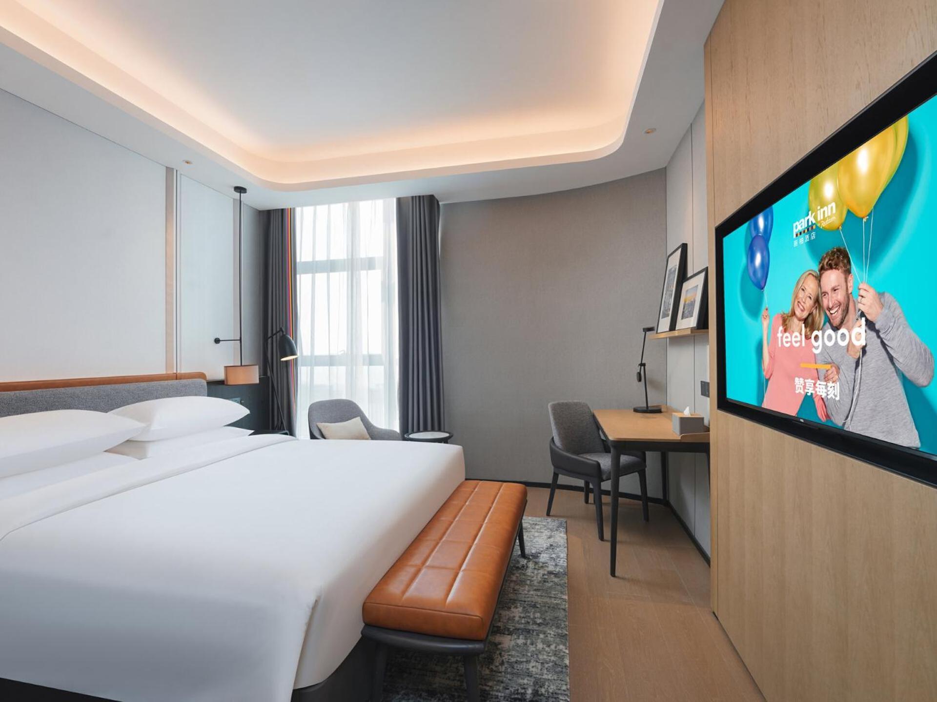 Park Inn By Radisson Nanchong Yilong Star City Plaza Esterno foto